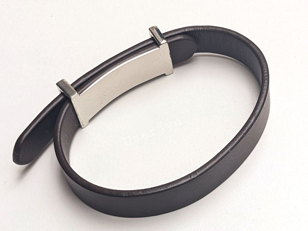 Thumbnail: Close-up of a black leather belt with silver buckle and details