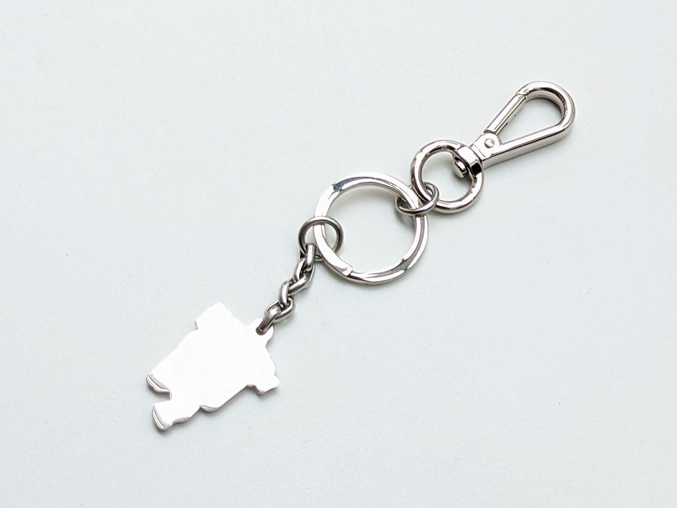 Thumbnail: Silver metal keychain with character charm