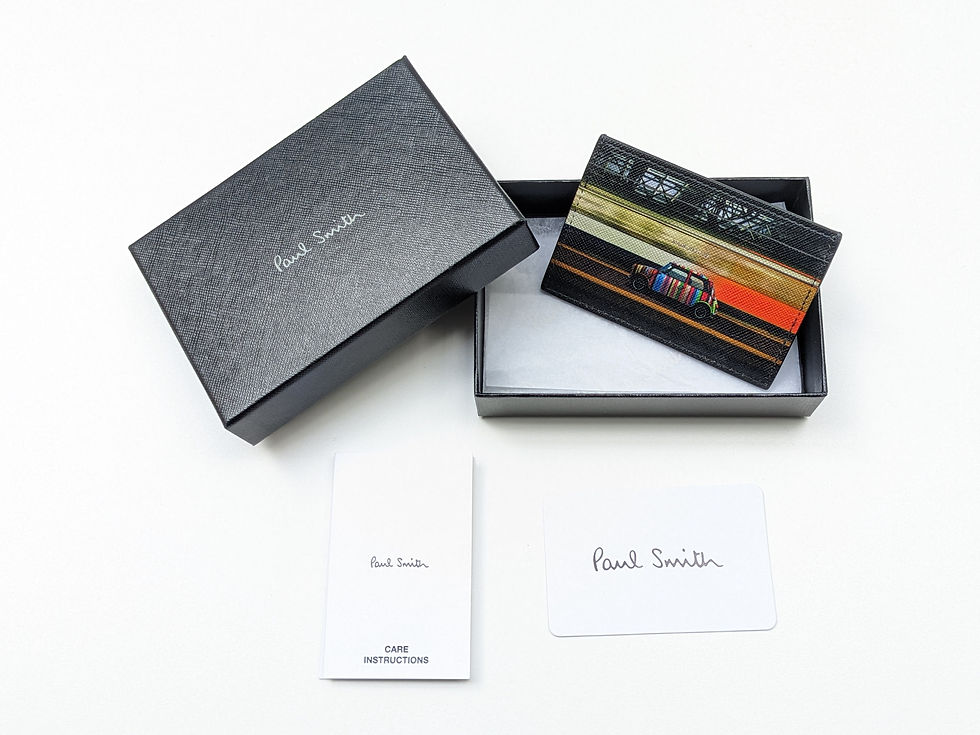 Thumbnail: Paul Smith wallet with striped design in open gift box with cards.