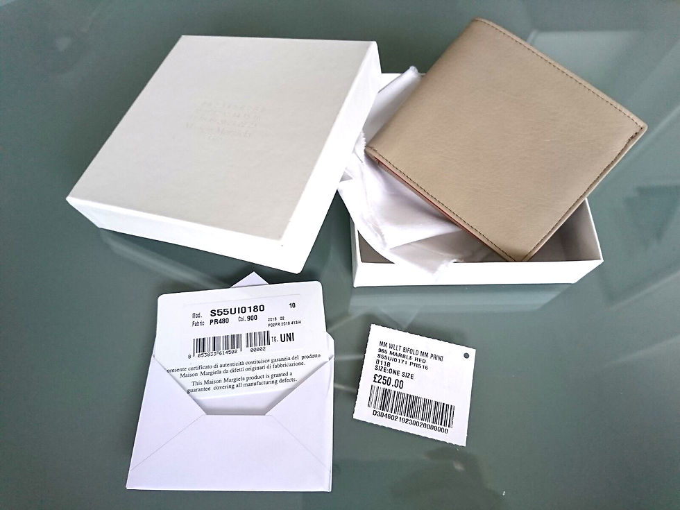 Thumbnail: Light brown wallet in open box with product tags