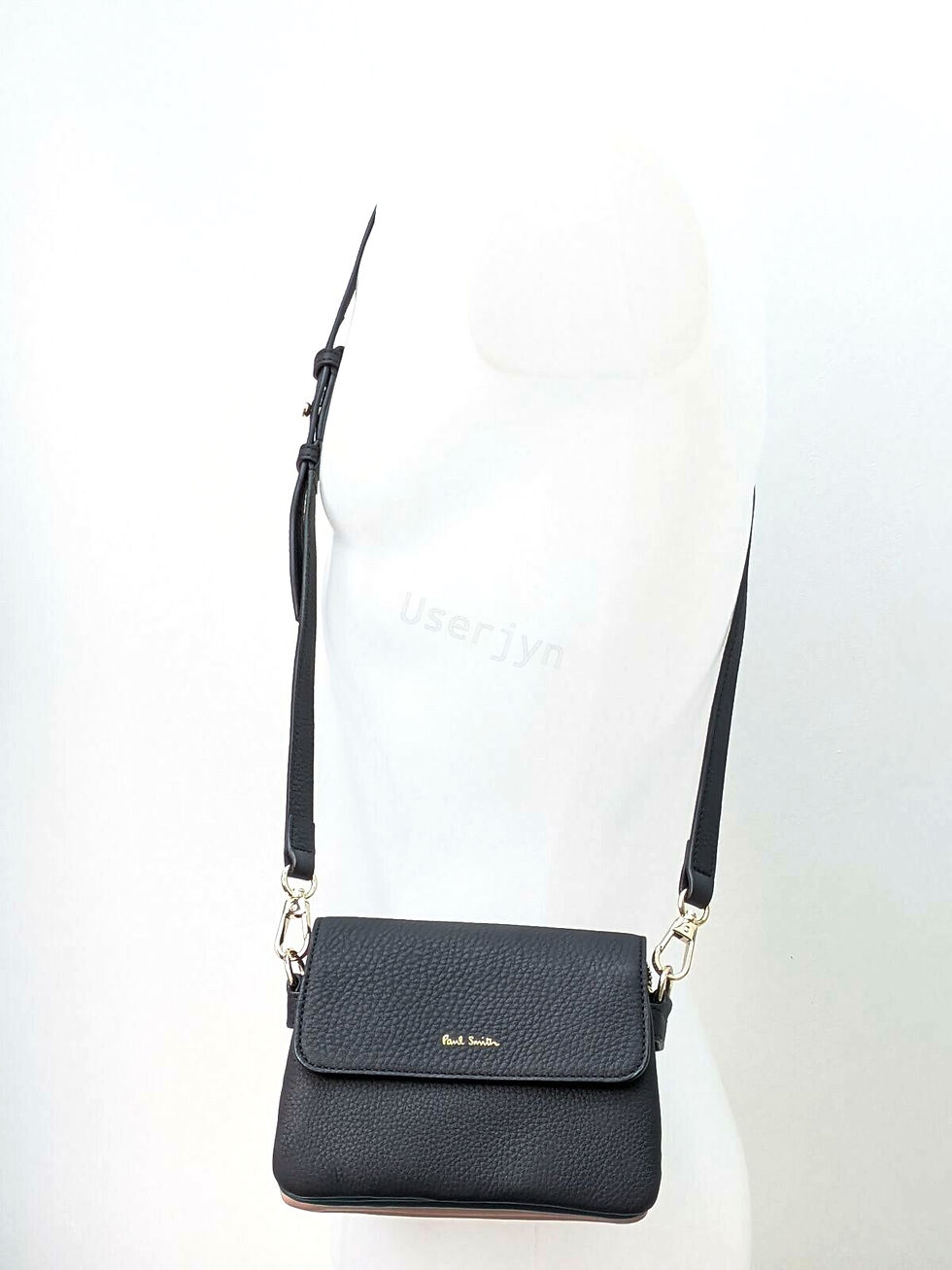 Thumbnail: Paul Smith dark leather flap purse worn on mannequin