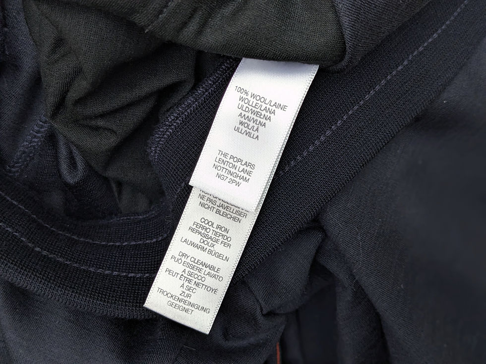縮圖：Clothing label showing 100% wool content