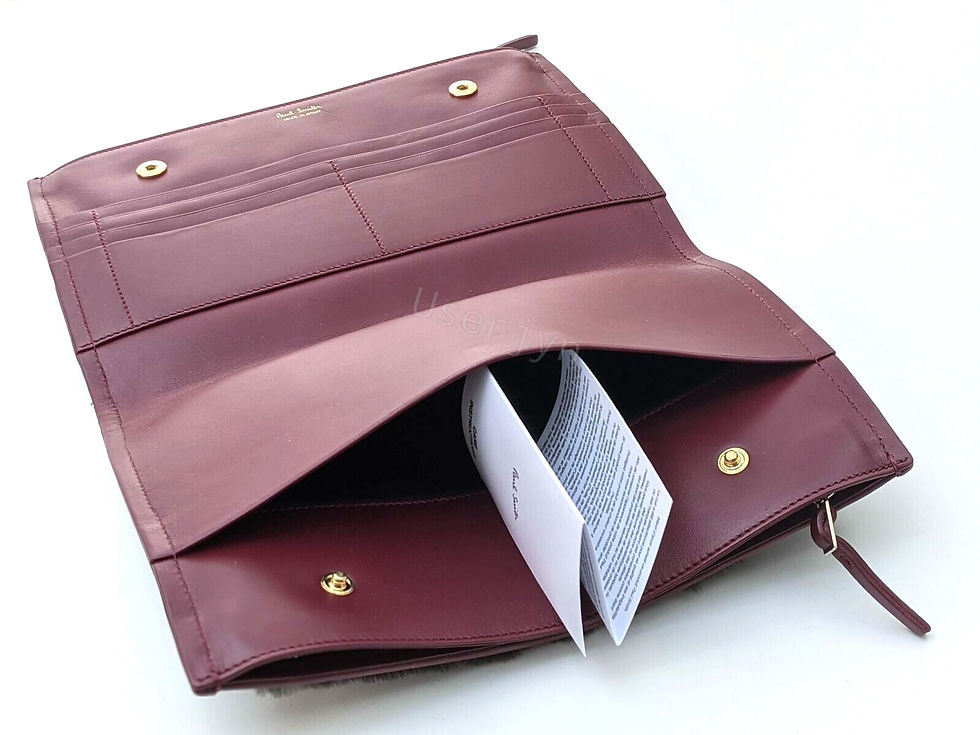 縮圖：Open maroon leather wallet with interior compartments