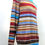 Thumbnail: Colorful striped sweater on a mannequin, showcasing various vibrant hues, fashion.