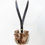 Thumbnail: Leather pouch with neck strap, brown, tan, and white, animal face design.
