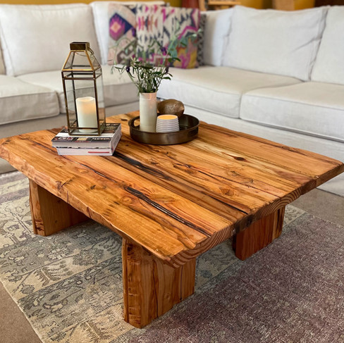 Redwood coffee table with a live edge design.