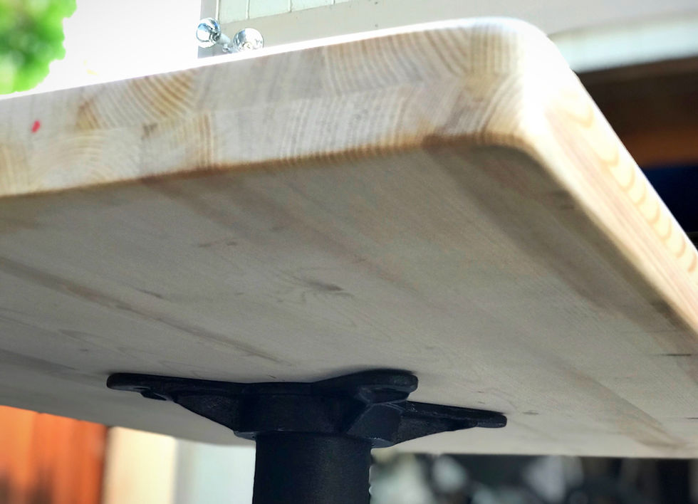 Restaurant table top handcrafted from reclaimed pine wood with a natural wood tone.