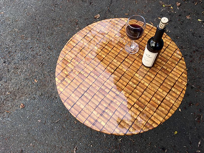 Round cafe table with high-gloss finish.