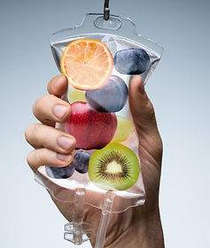 empower-pharmacy-hand-holding-iv-bag-with-fruit-and-liquid-in-it.jpeg
