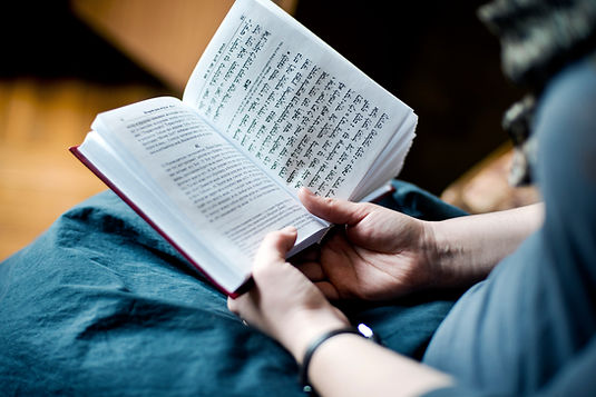 Hands holding a prayer book