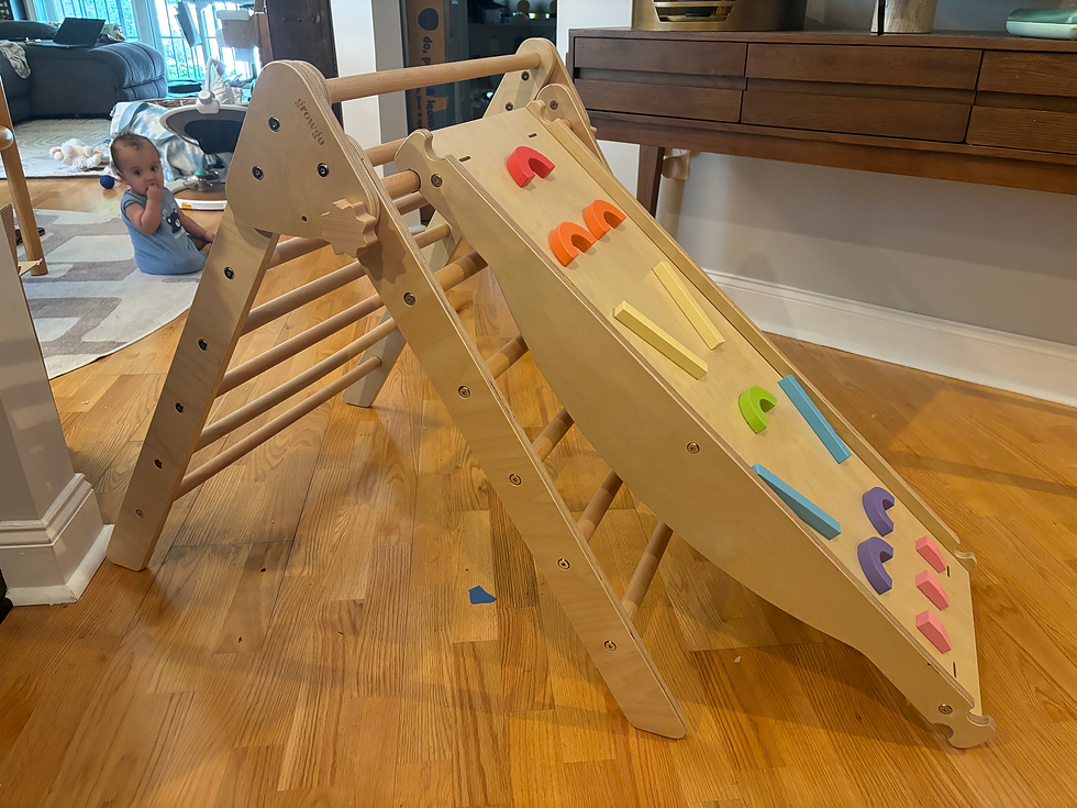 A Pikler Triangle with the climbing wall attachment