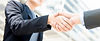 businesswoman-making-handshake-with-businessman_edited.jpg