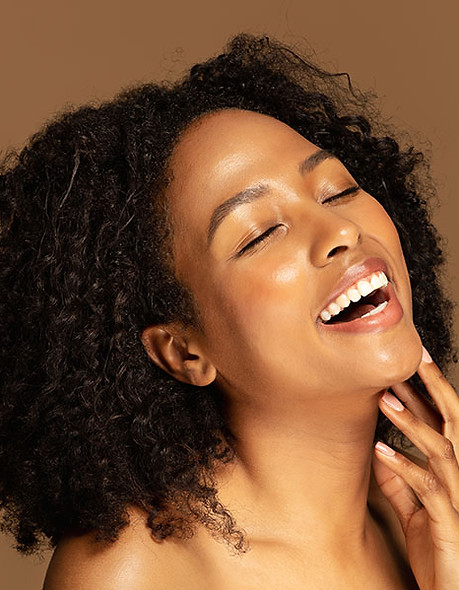 Laughing-sensual-half-naked-black-lady-touching-her-chin.jpeg