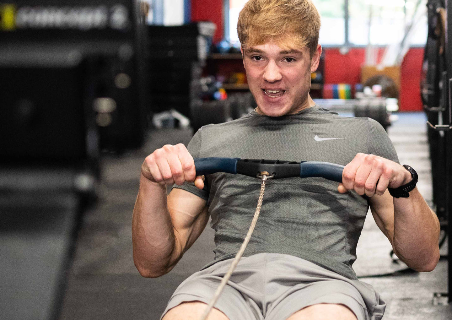 Young man working out on the rower