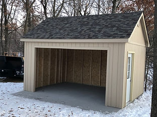 Open-front garage shed with reinforced framing and wide opening for storage and equipment