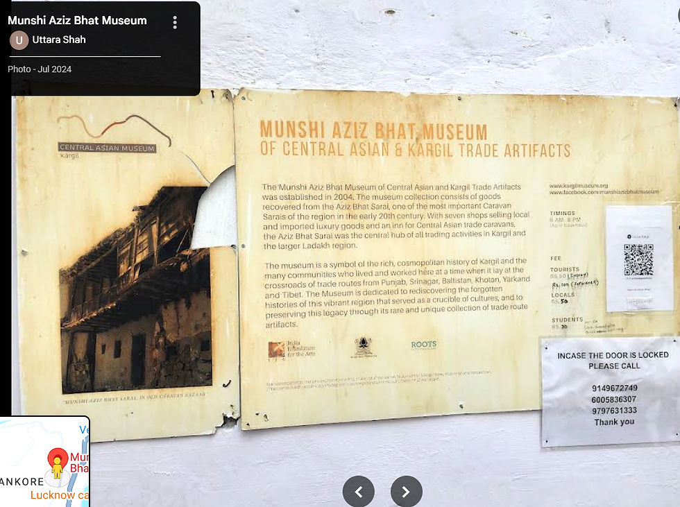 Weathered museum signboard on a white wall for Munshi Aziz Bhat Museum of Central Asian & Kargil Trade Artifacts, with notices and QR code