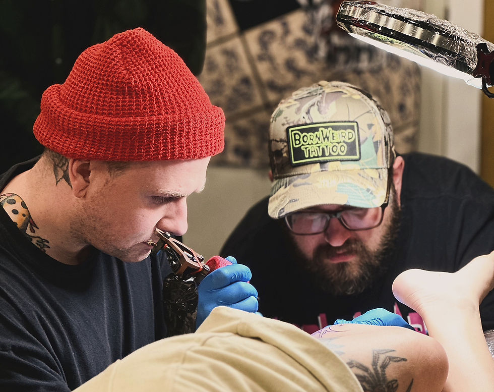 Jack Laiche tattooing during his apprenticeship at First Street Tattoo Parlor
