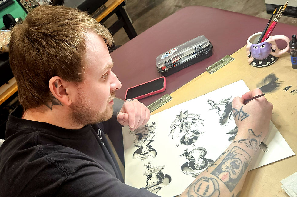 Jack Laiche painting traditional tattoo flash during his apprenticeship