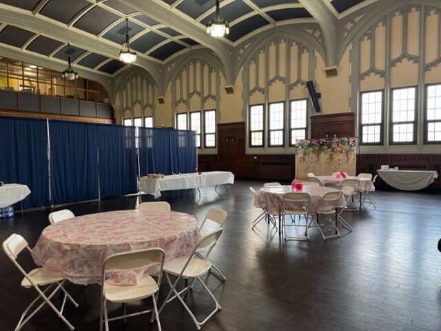 tables and chairs in auditorium 