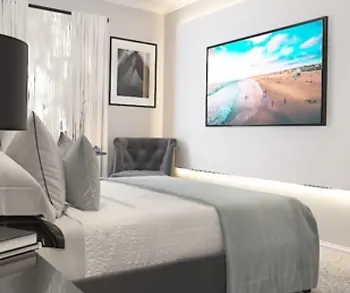 Modern bedroom suite with large TV