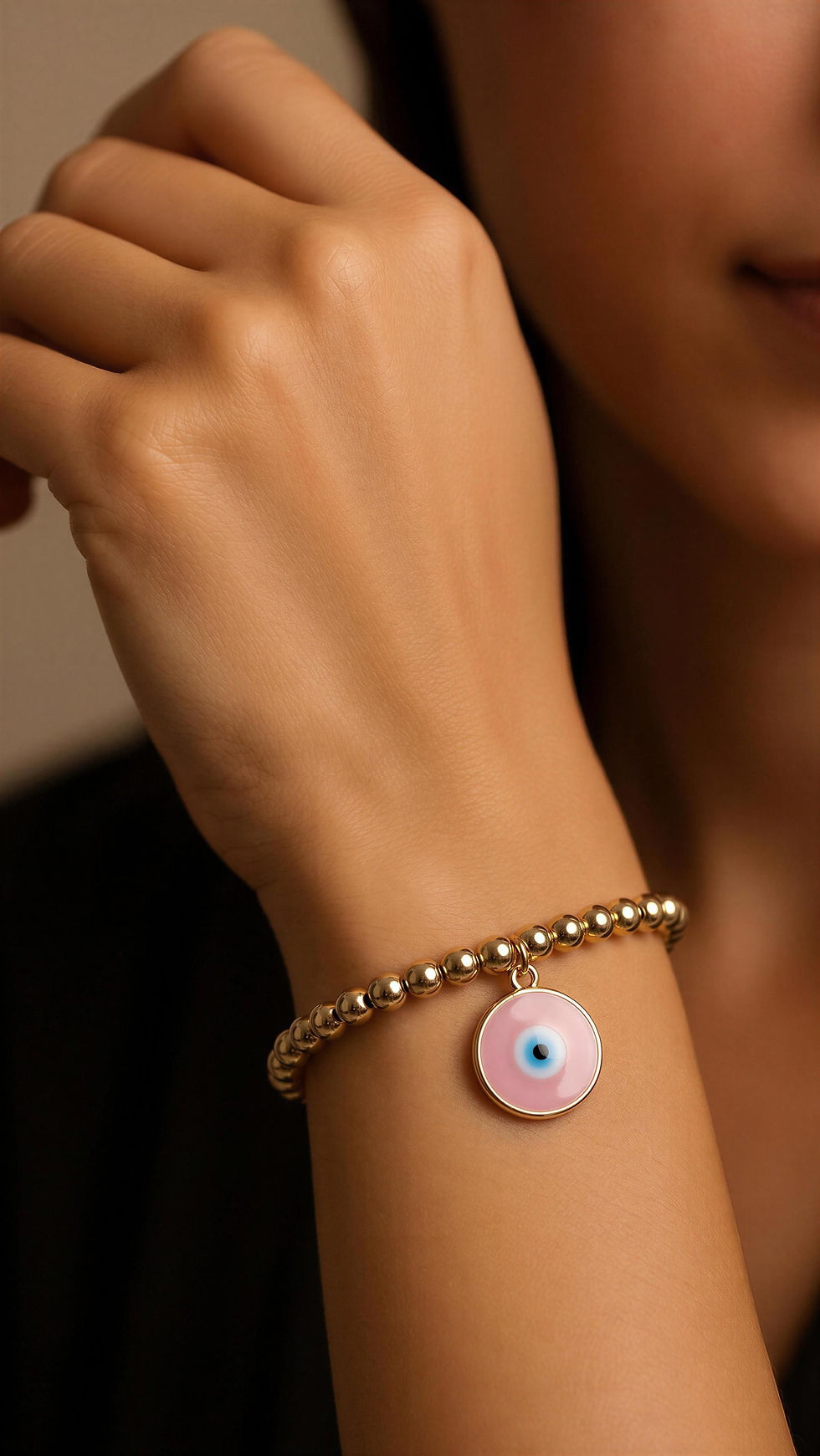 Thumbnail: Black and pink bead bracelet with a Greek eye charm.