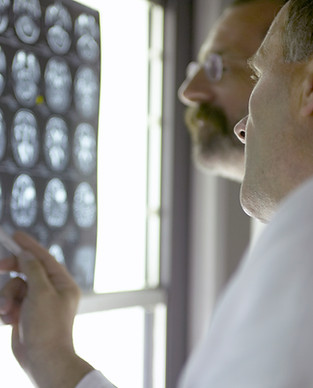 Doctor Analyzing X-Rays