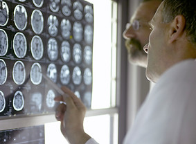 Doctor Analyzing X-Rays