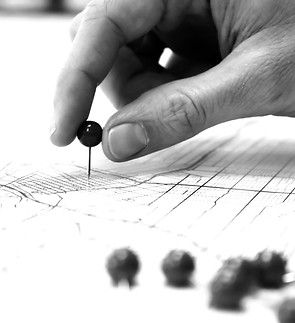 Placing red push pins into city street m