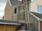 House with scaffolding, with rendering work being completed by AJ