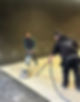 Two specialists using industrial floor polishing machines on a large marble floor area