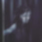 A monochromatic painting of a person with long, wet hair, eyes closed, and a serene expression