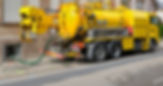 A yellow DAF truck with a pump arm