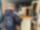 Man securing furniture and boxes inside a moving van