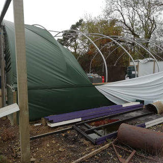 Ongoing construction of a cylindrical shed