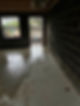 Unfinished construction site with wet concrete floor
