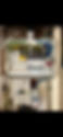 Close-up of a residential circuit breaker panel displaying multiple circuit breakers, wiring, and safety labels
