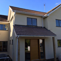 A newly rendered house with complete roofing