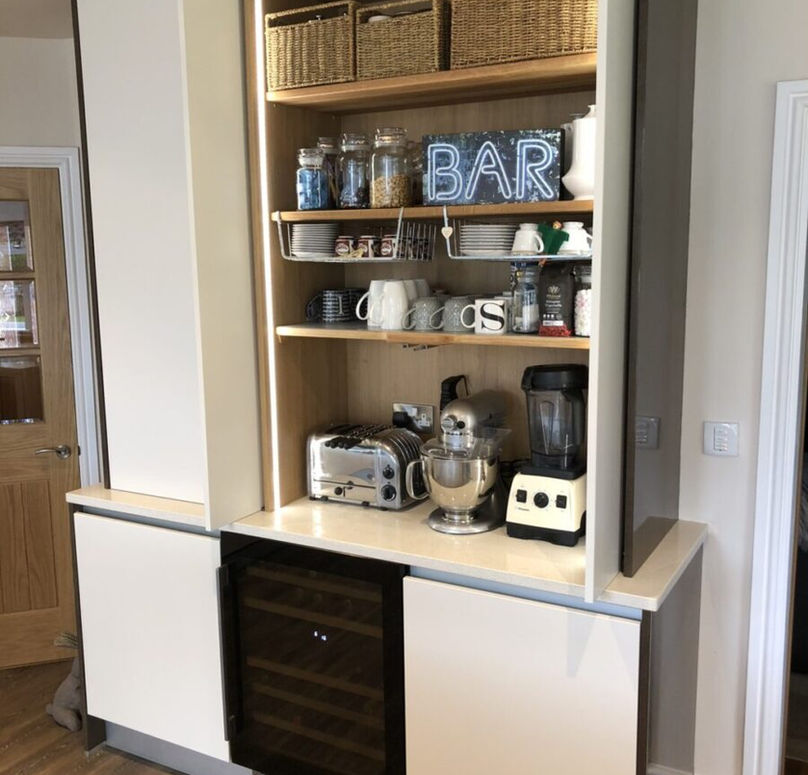 Kitchen storage with open shelves displaying glassware