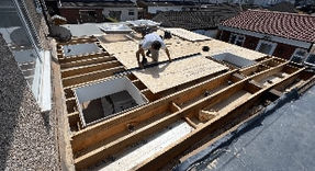 A professional installing a roof
