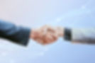 Two people shaking hands against a blue background with white, interconnected network lines