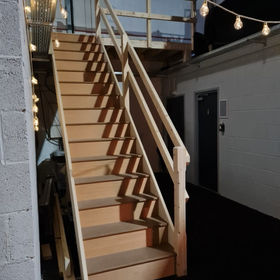 Wooden staircase with hanging lights

