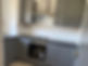 Modern kitchen with sleek gray cabinets,