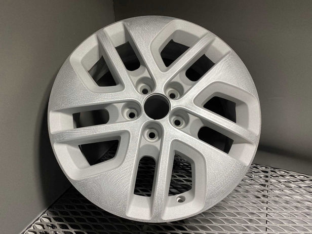 chemically stripped alloy wheel