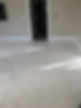 Highly polished white marble floor with grey veining showing a professional finish