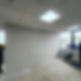Empty office space with a grey wall under construction