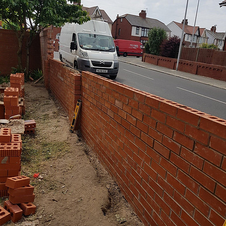 Construction site with brick wall