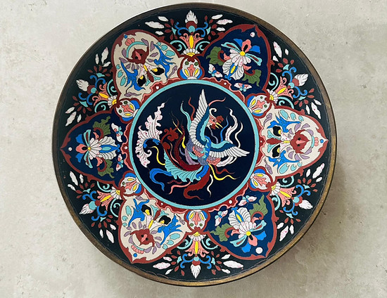  19th-century Japanese cloisonne charger featuring a dynamic phoenix motif and complex enamel colors, bought by Antiques of Sussex. 