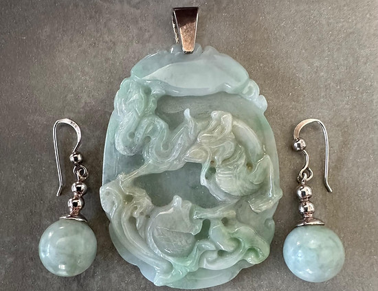  20th-century Chinese carved jade pendant with matching drop sphere earrings mounted in sterling silver. 