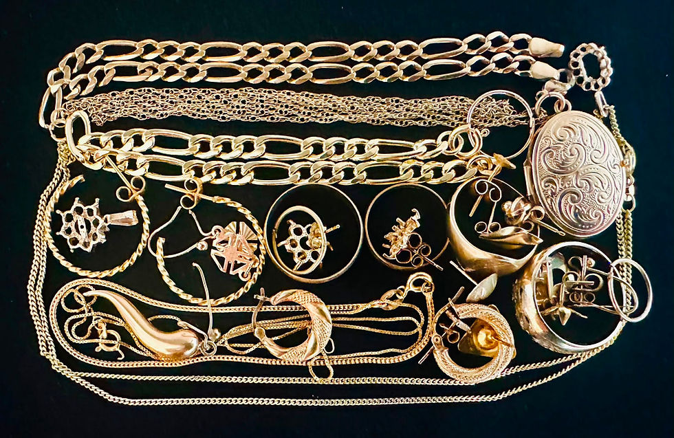 Selection of gold jewellery including chains, rings, pendants and bracelets, representing items valued and purchased by Antiques of Sussex.
