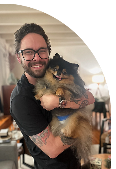 carter wilkes holding dog Ozzy, portrait